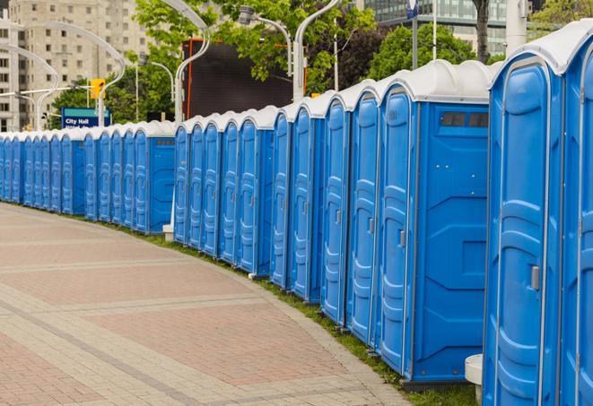 a row of portable restrooms at a trade show, catering to visitors with a professional and comfortable experience in Garfield